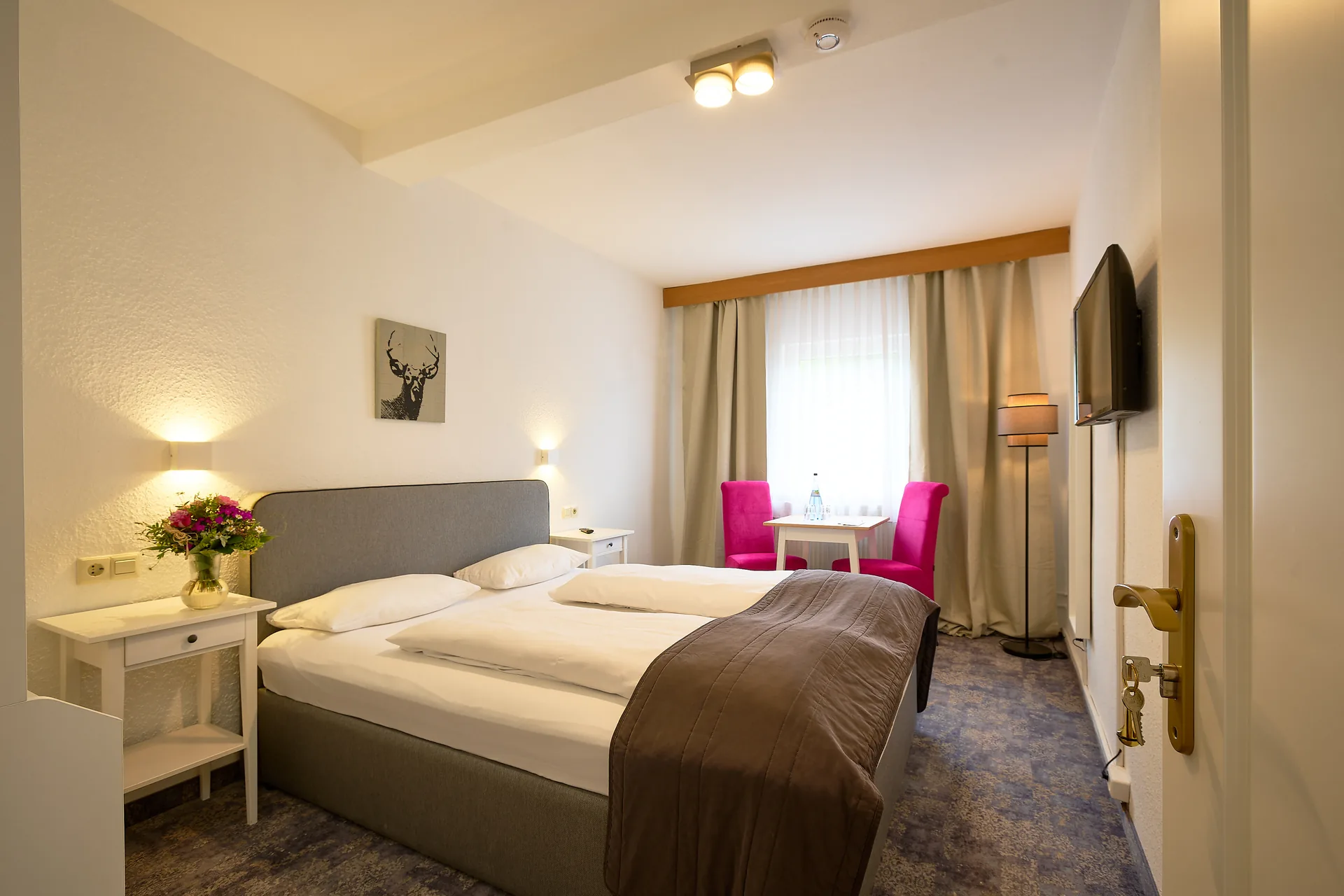 Standard-Doppelzimmer mit Doppelbett und Sitzecke